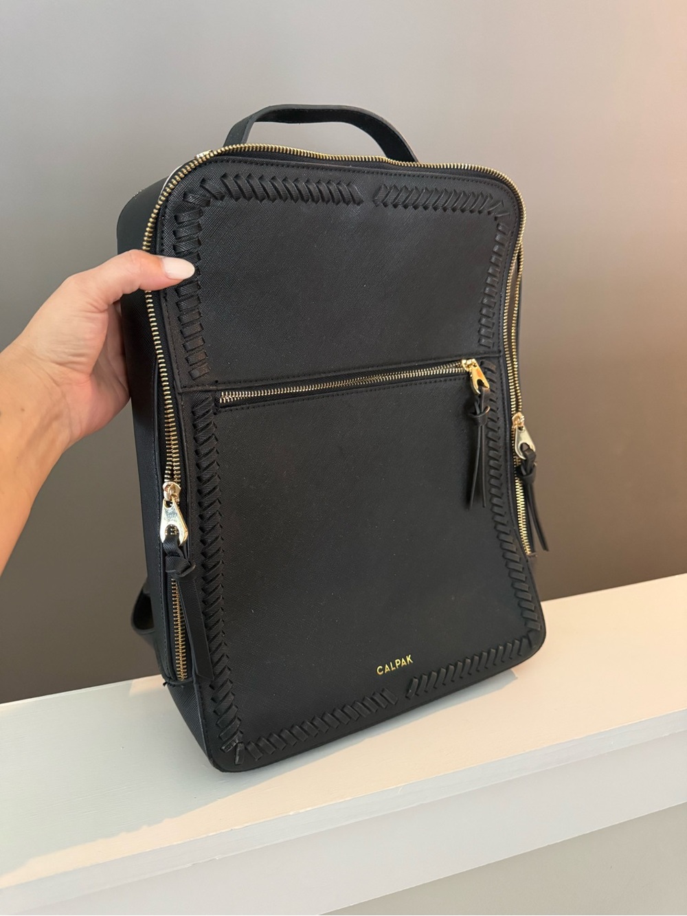 Calpak Black Backpack with Gold Hardware and Whipstitch Trim